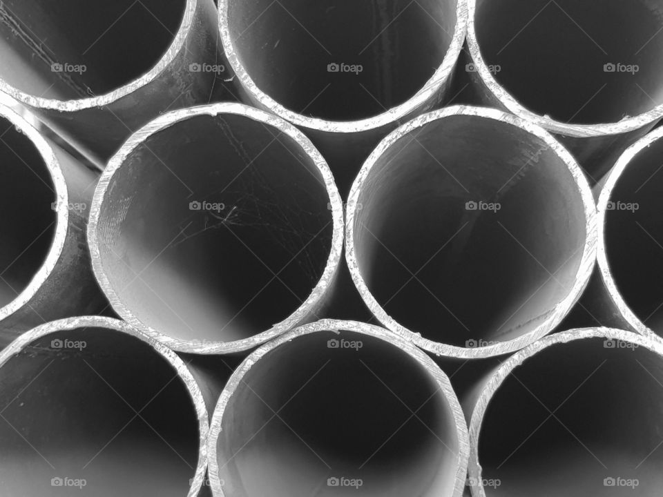 iron pipes background.  black and white photo.  world of circle shapes concept!