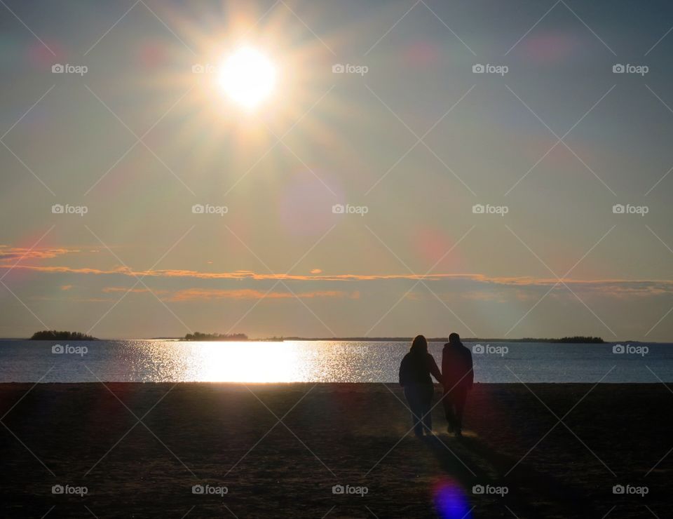 Couple  walking  in  sunset 