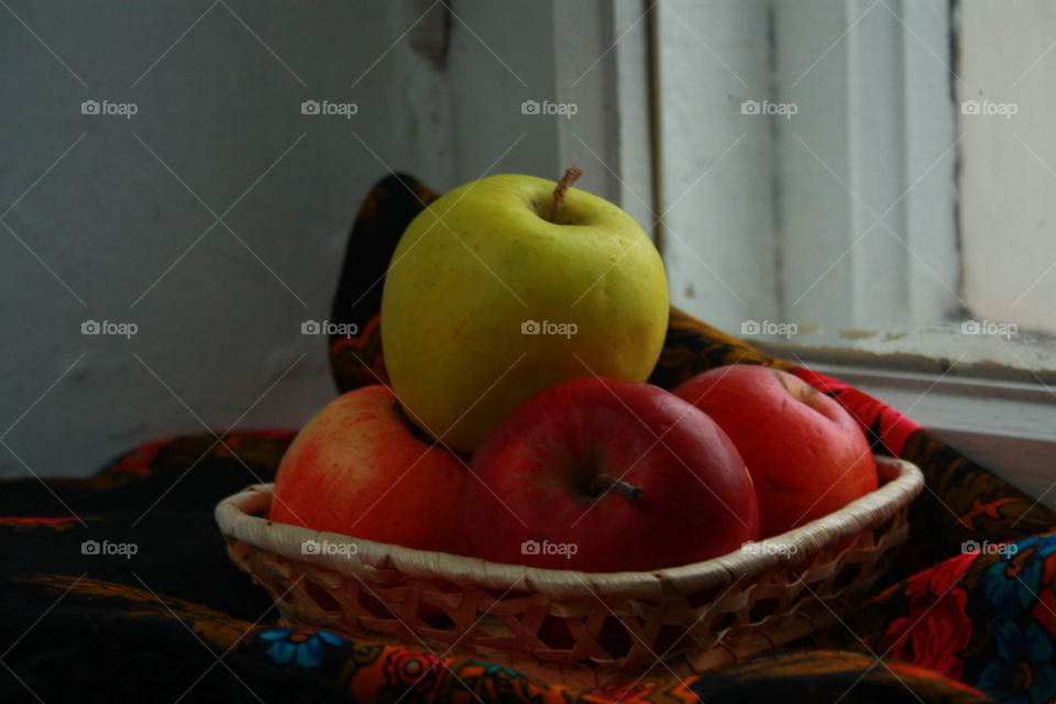 apples in the basket on the window