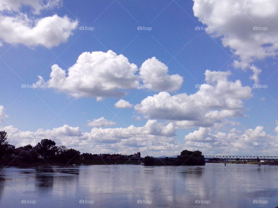 White clouds above mighty river