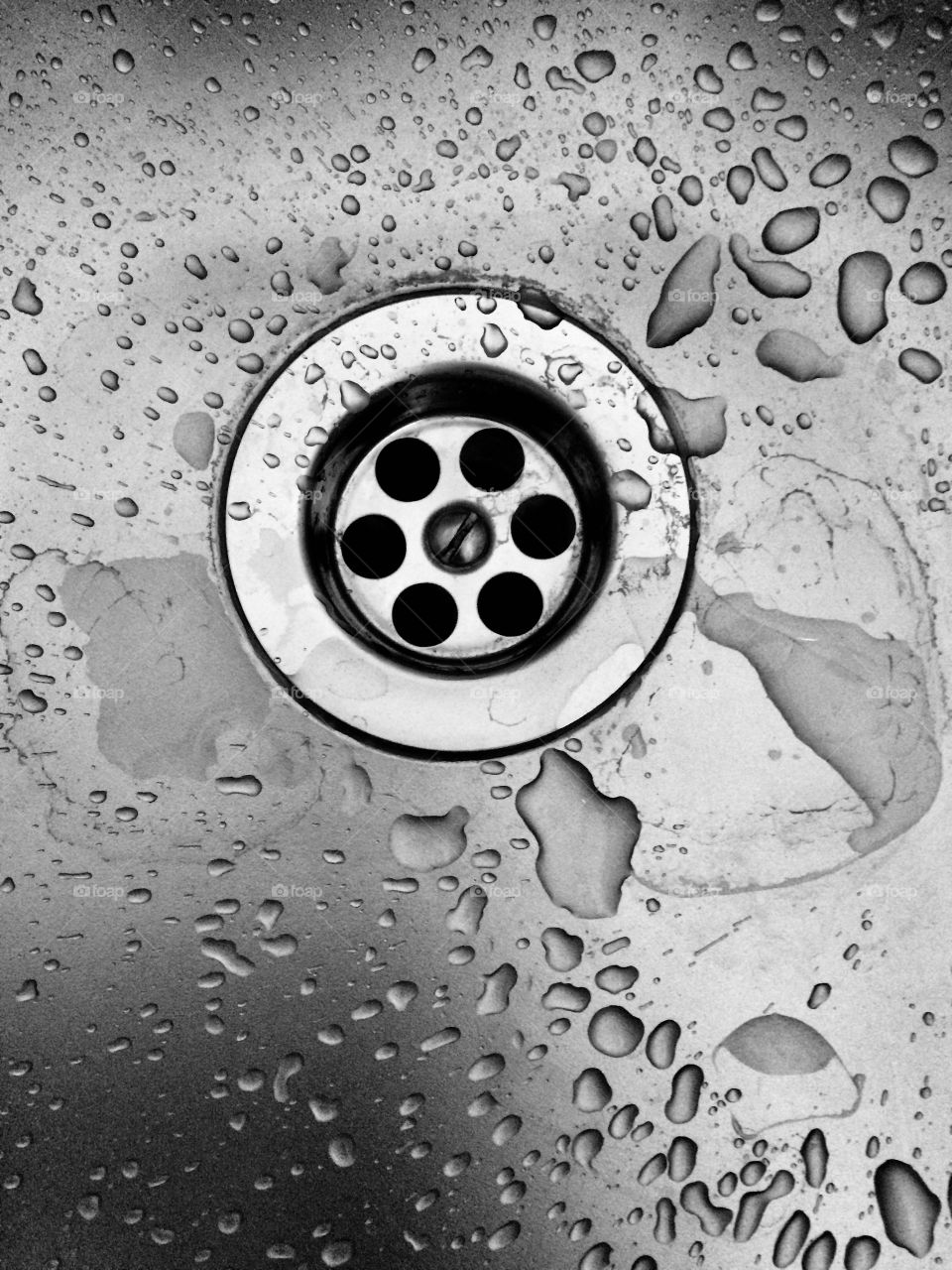 Water drops in a kitchen basin 