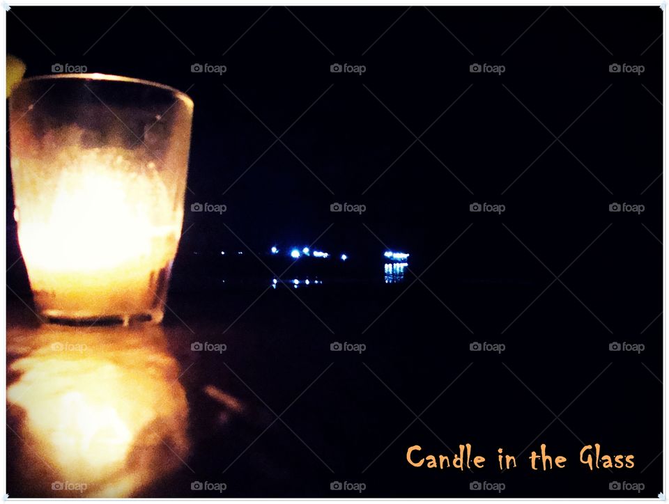 Candle in the glass. Night at Ende Beach, Ende, Flores Island, Indonesia