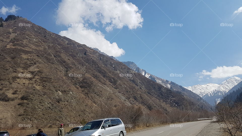 mountain road with clouds