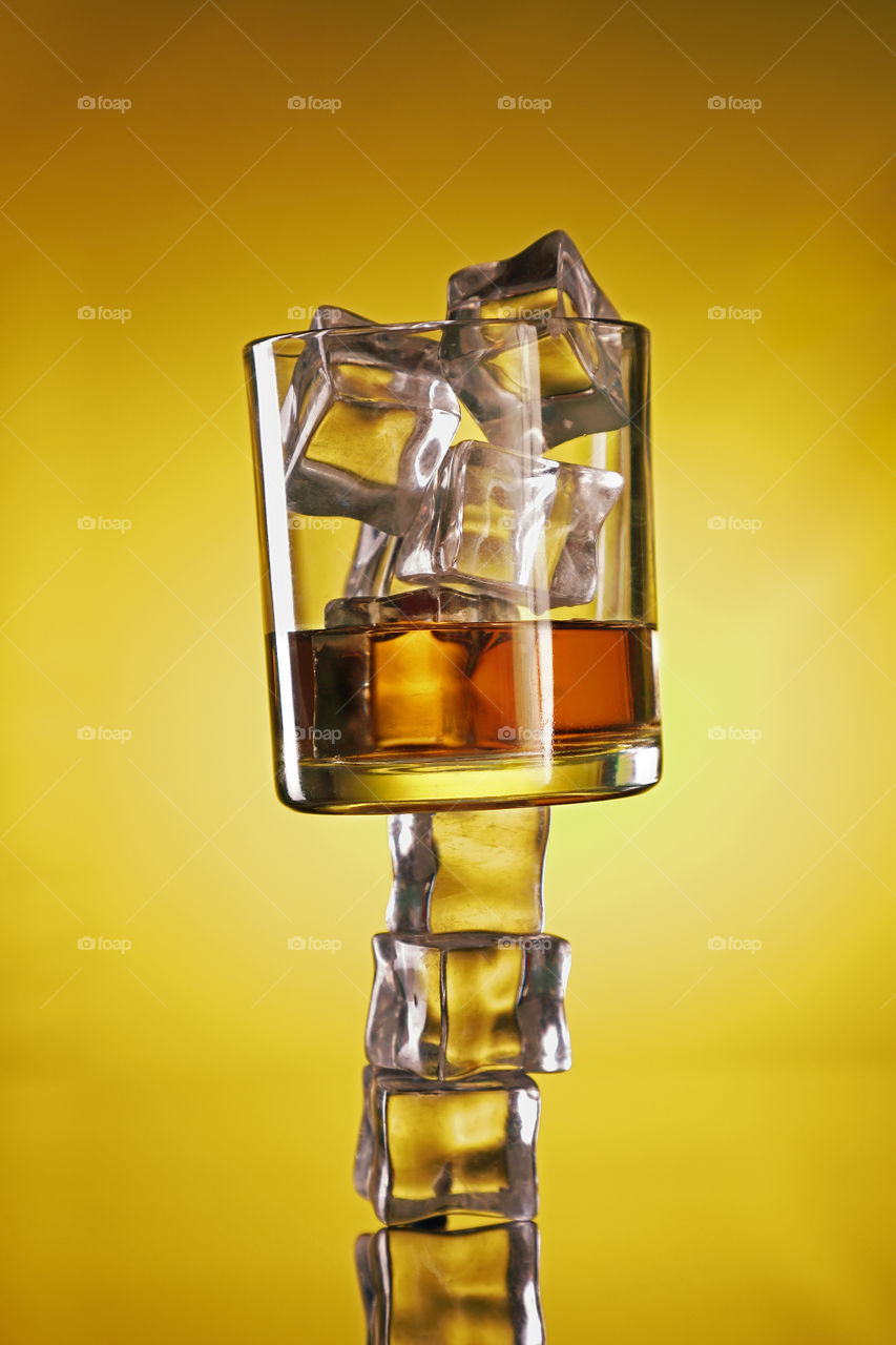 Creative idea whisky glass with ice cubes