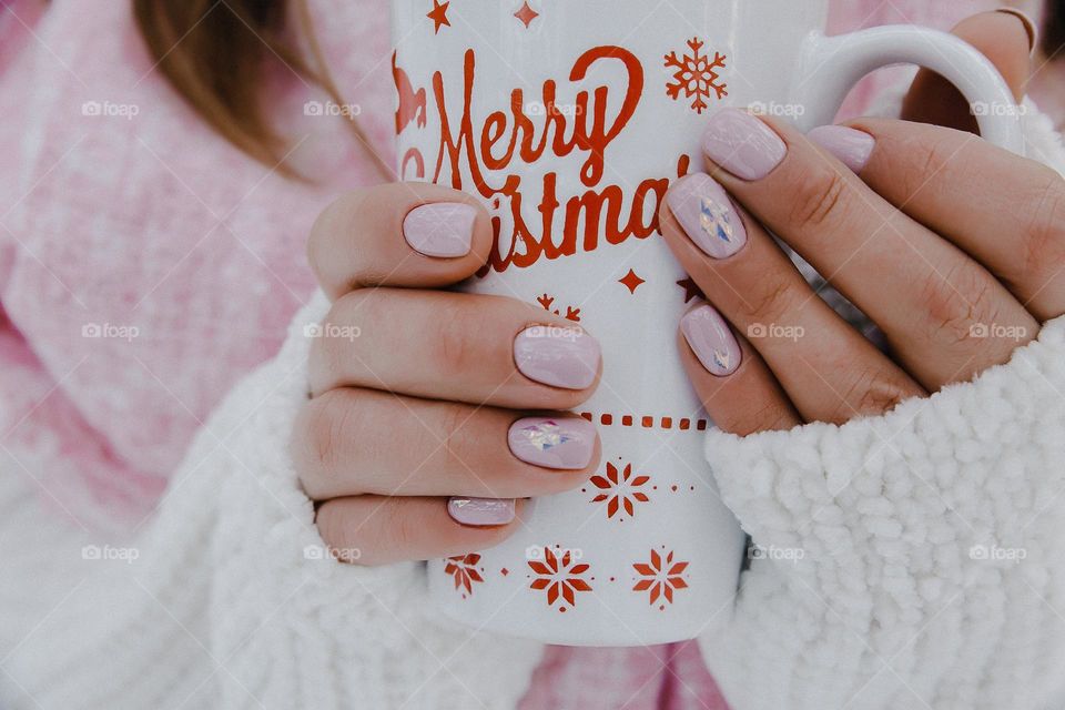 Rose nude manicure. Merry Christmas. New Year. Warm