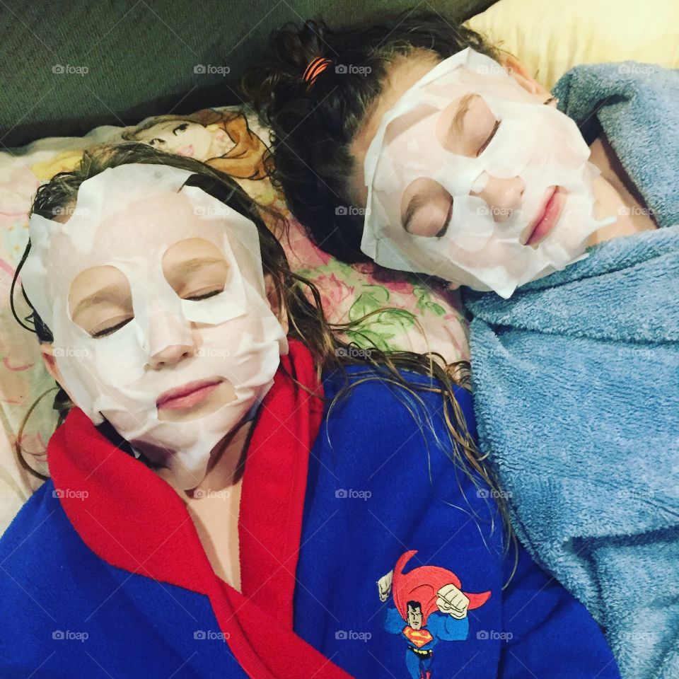 Two little girls applied natural face mask