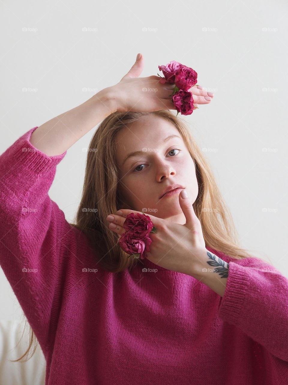 Young beautiful blonde girl in pink sweater, portrait of girl 