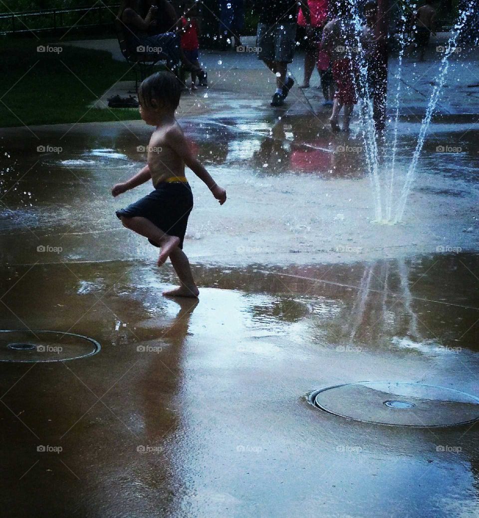child playing in the water