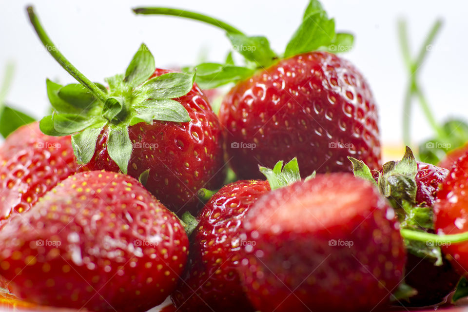 Tasty and delicious red strawberries white background on the plate