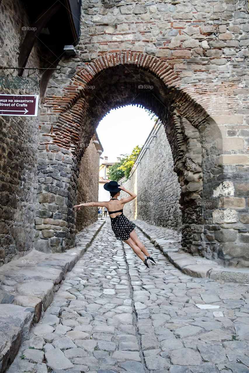 Young Female Ballerina Dancing Outside