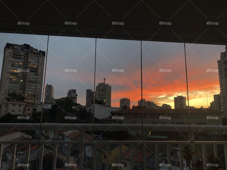 Sunset view through the balcony window