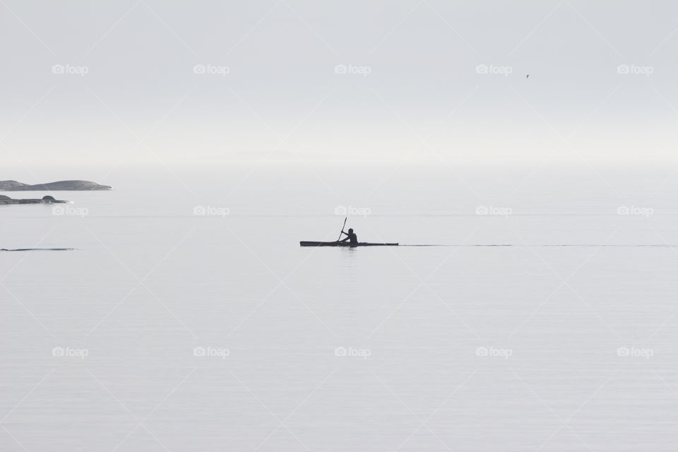Minimalistic , kayaking on the sea , fog