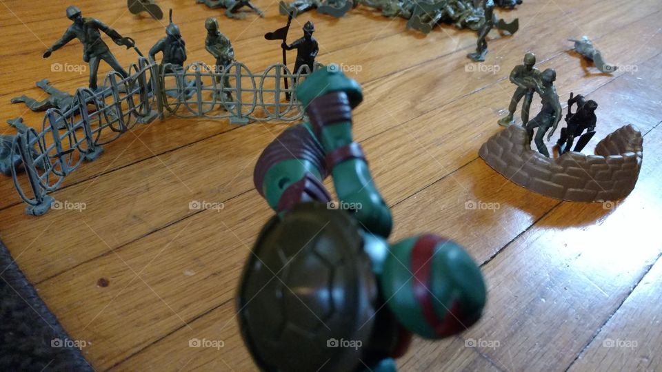 Teenage Mutant Ninja Turtle toy soldier display pretend boy imagination scene.