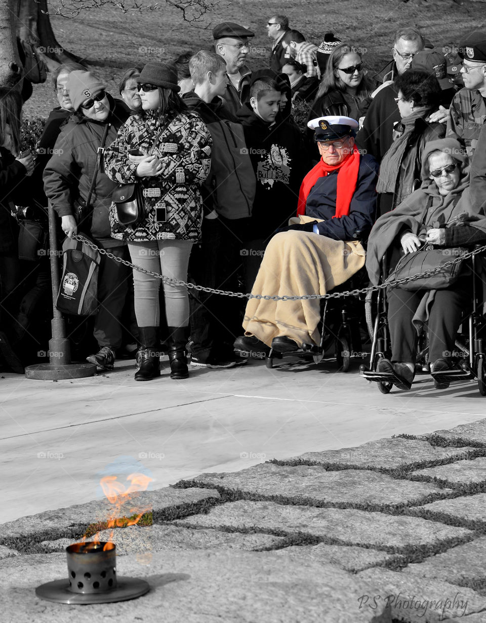 JFK Eternal Flame. Arlington National Cemetery veteran at JFK's tomb