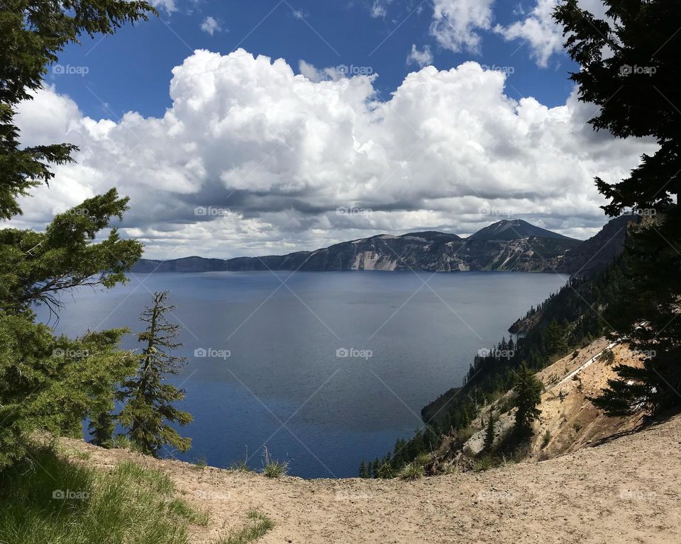 Beautiful crater lake with a thick cloudy sky