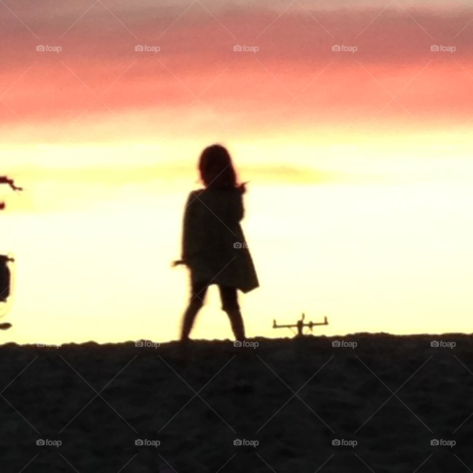 Standing on the dunes at sunse. Taking a walk on the dunes of the beach at sunset 