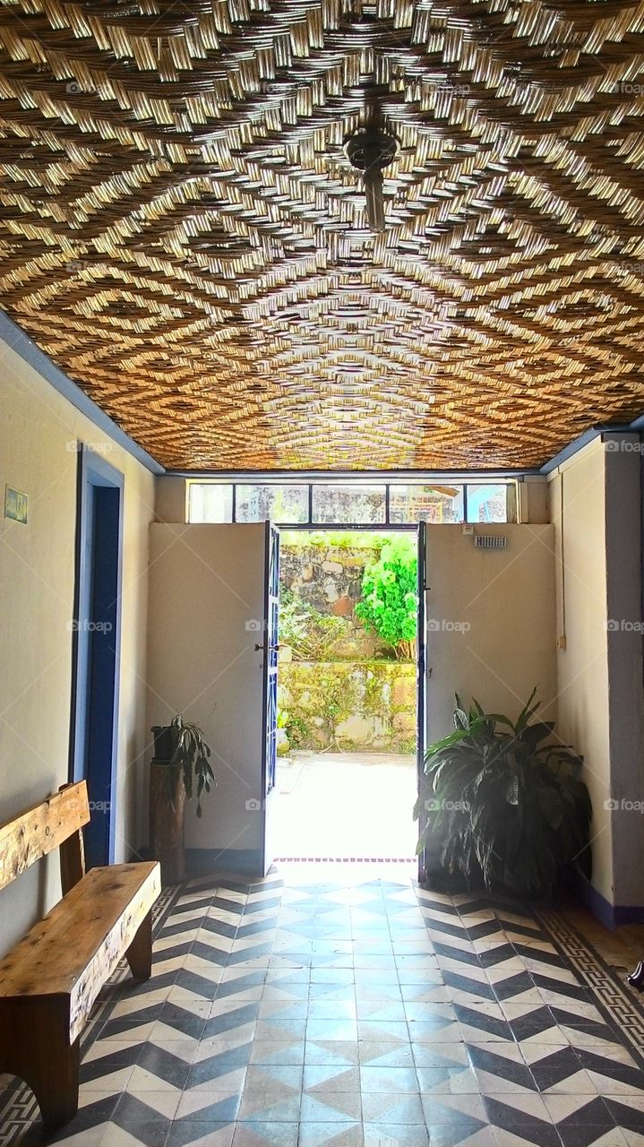 Door to the roof with straw braided