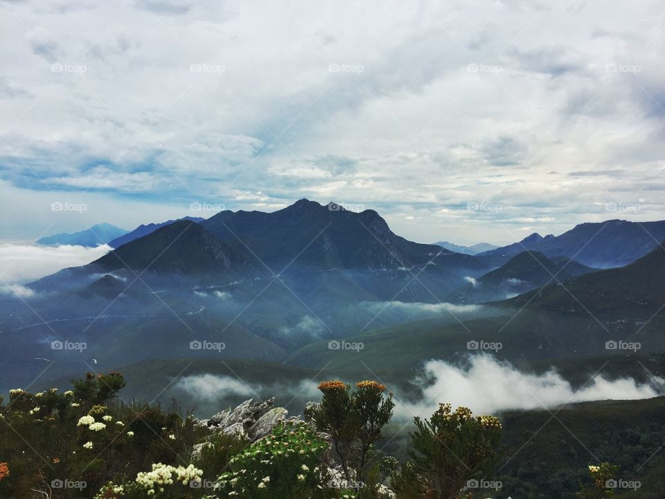 Scenic view of mountains in fog