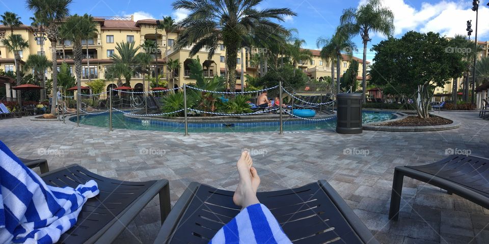 Soaking up the sun by a lazy river at a resort 