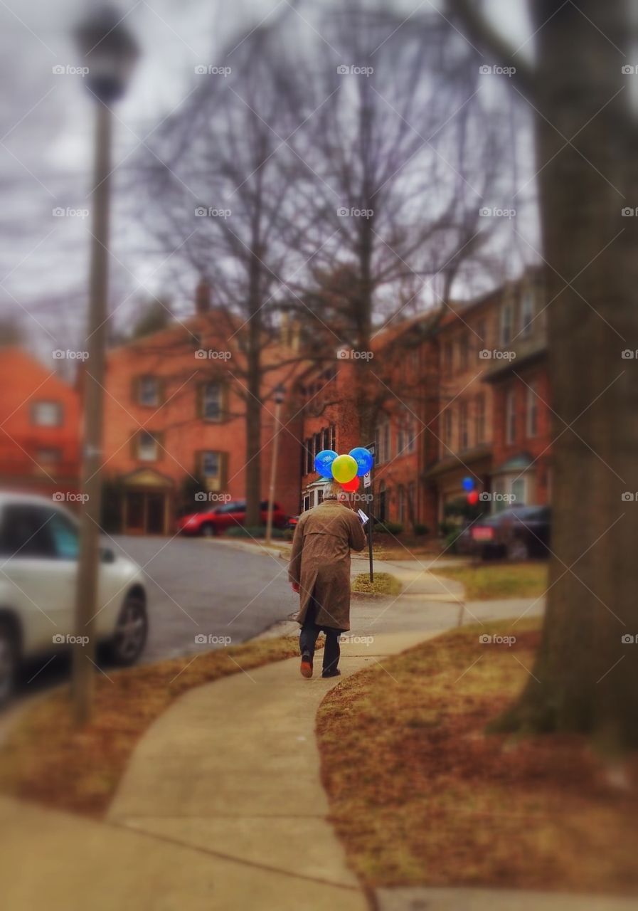 Old man and balloons