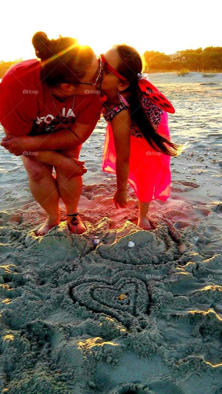 memories of summer  mother daughter on the beach as sunsets