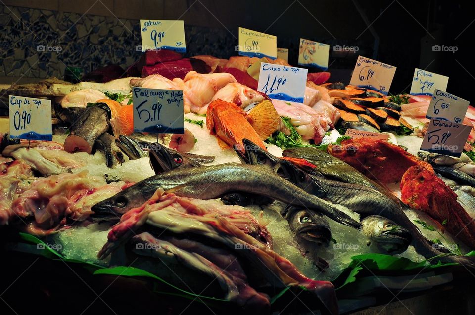 fresh fish on ice on market stall Spain