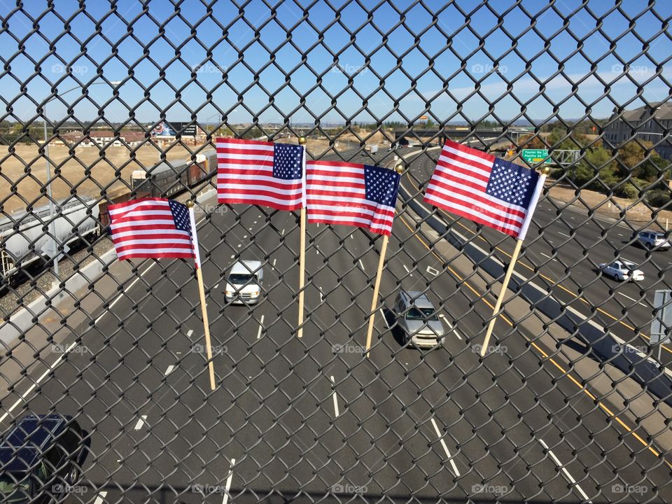 Memorial Day celebration small flags in over road 