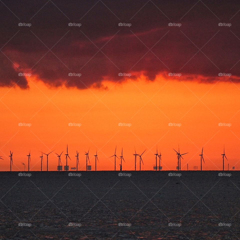 Windmills in red sunset