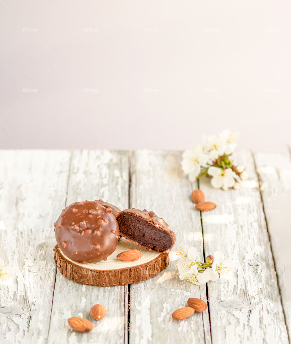 Traditional dessert Cake pops made by chocolate and almond flour on the wooden background.