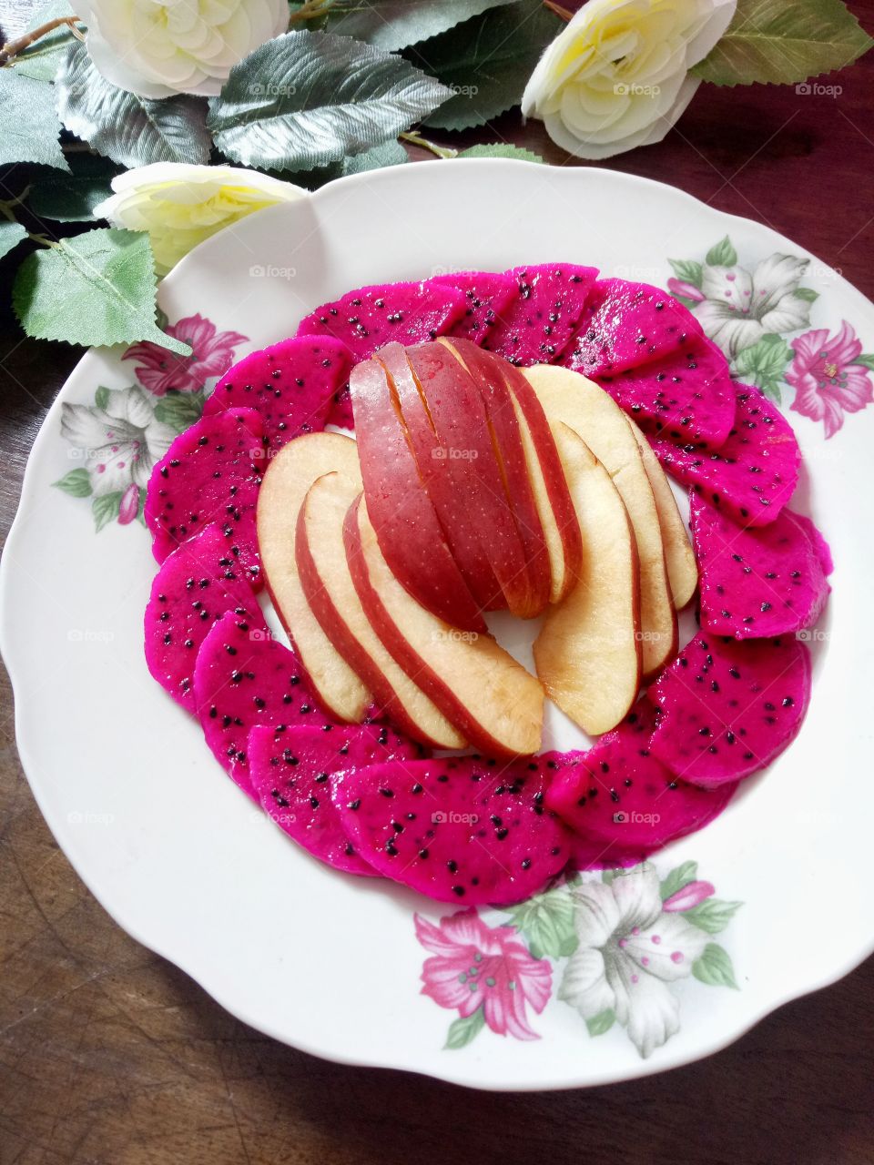 Fruits time for healthy breakfast. Sliced of dragon fruit and apple