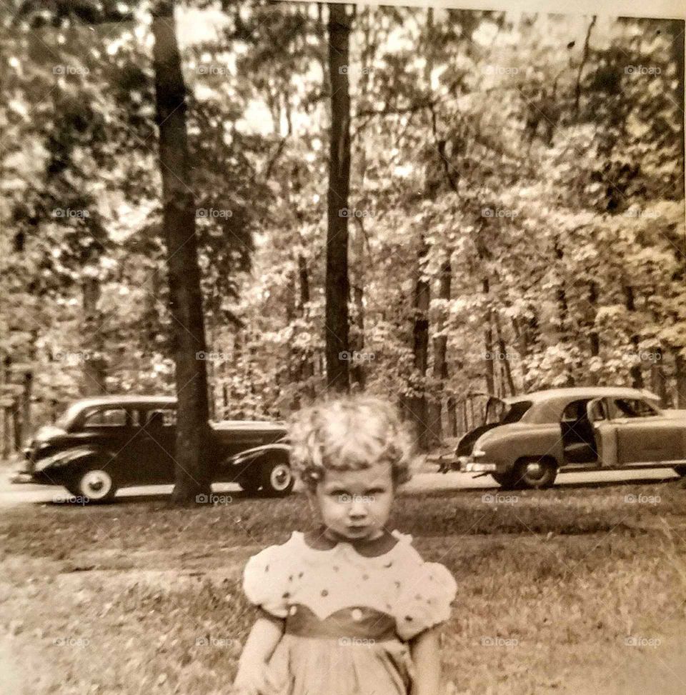 Crabby Toddler 1953  Memorial Day weekend. Veteran Ref Poppy Flower in hair