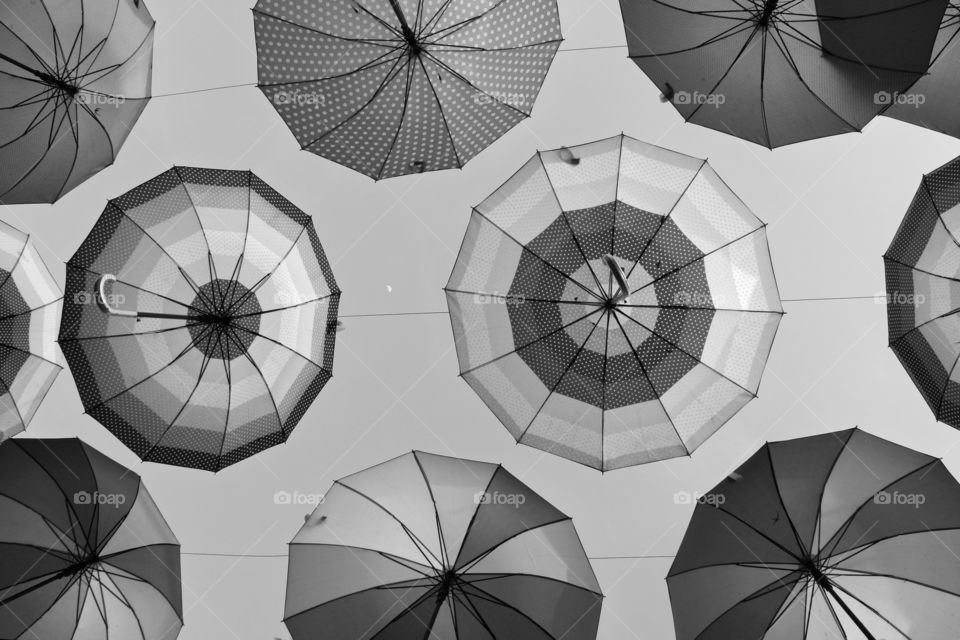 umbrellas under in the skies in BW