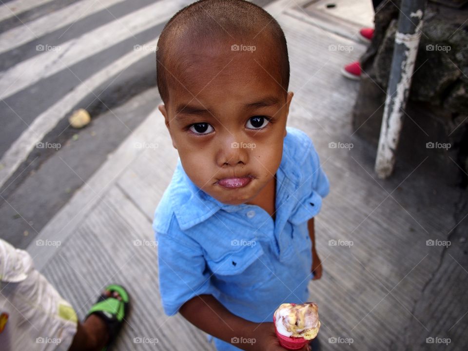 young boy eating ice cream