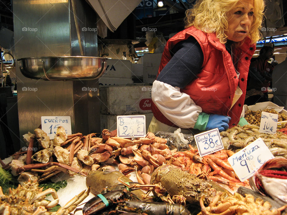 Fish merchant in Barcelona . Selling fish in the market