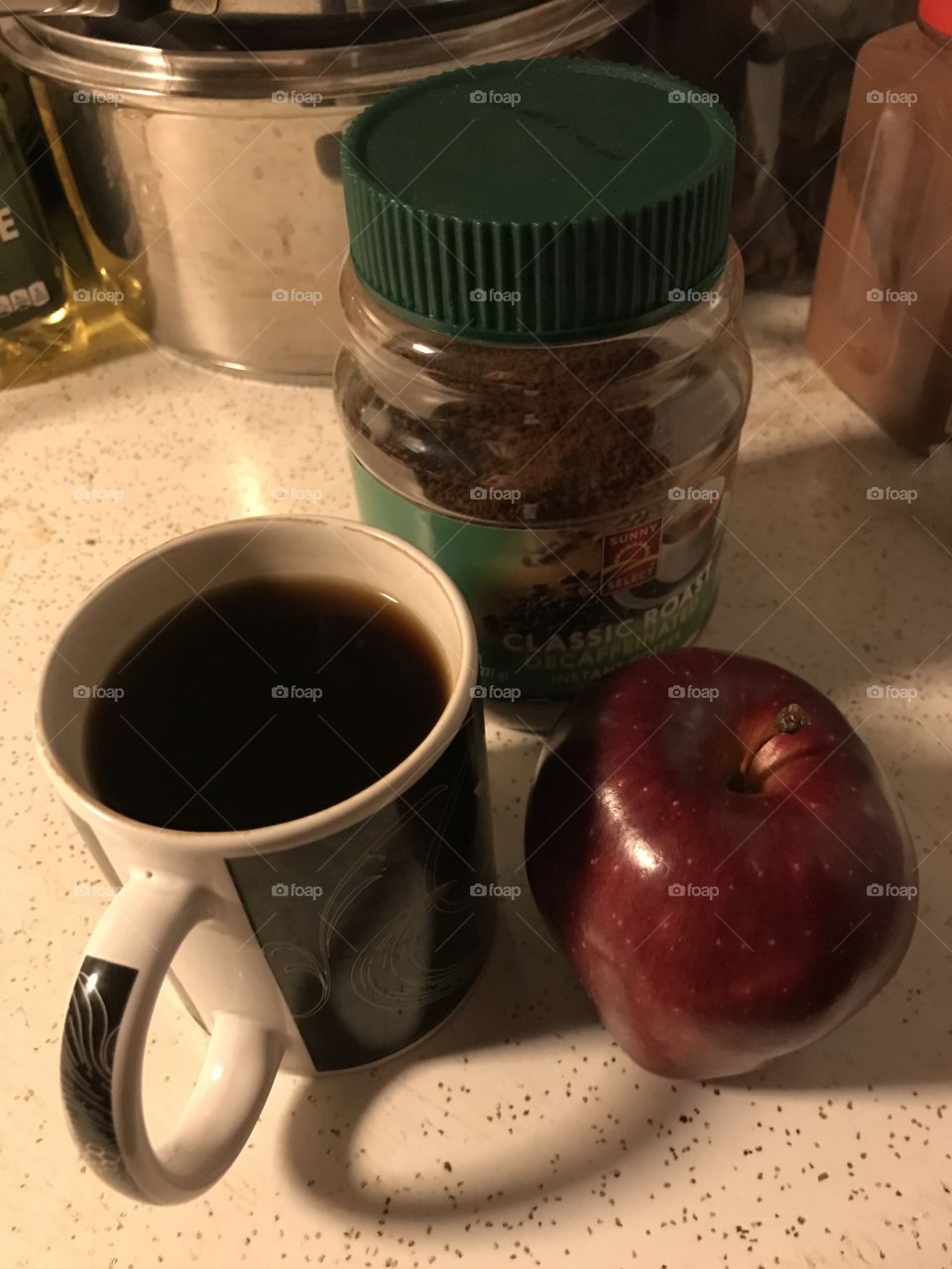 Instant black coffee with an apple. A simple way of enjoying this healthy beverage.