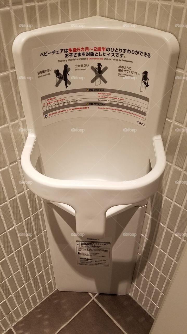 Baby holder in the bathroom