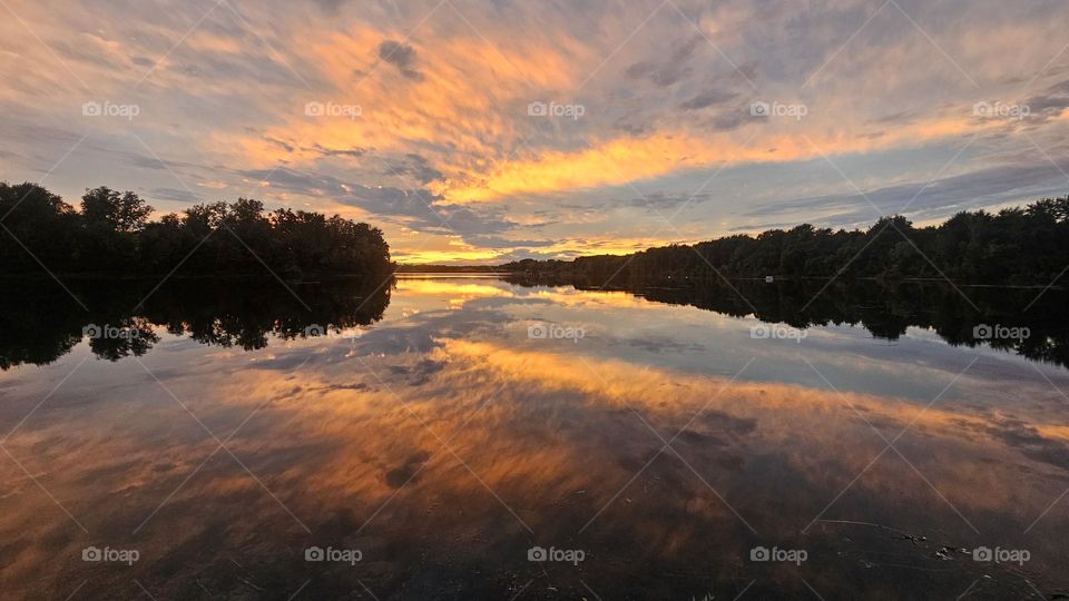 gravel pit lake at sunset