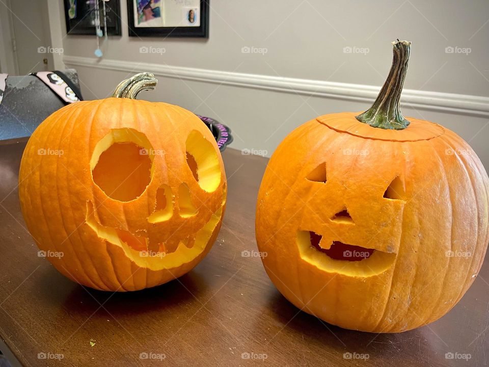 Two cute freshly carved pumpkins 