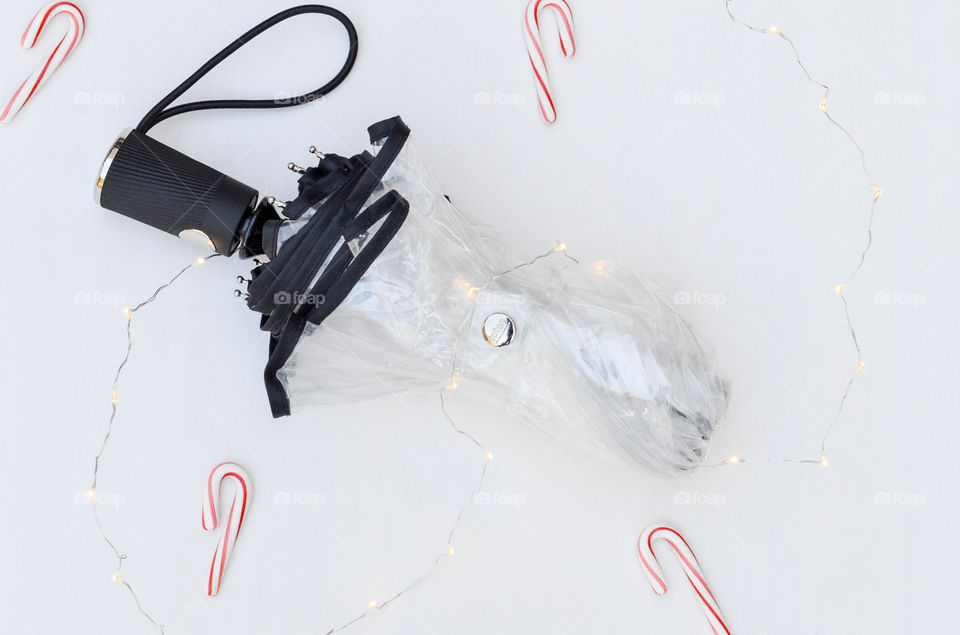 Clear umbrella with Christmas lights and candy canes