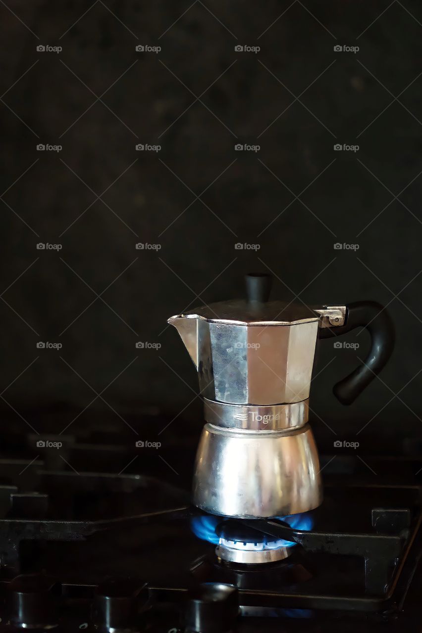 Close up of a kettle on a stove
Close up a kettle on a gas stove on blurred background.