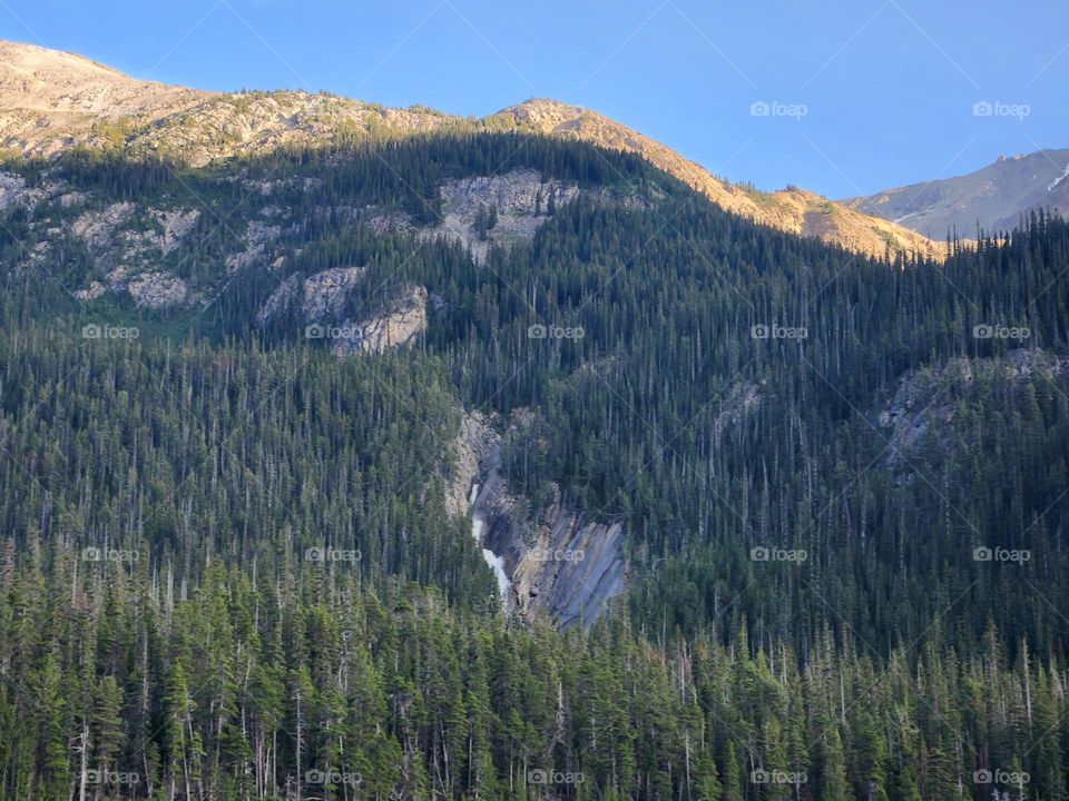 Waterfalls falling over big mountains
