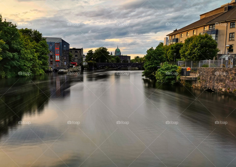 Corrib River flow with Galway cathedral in the background