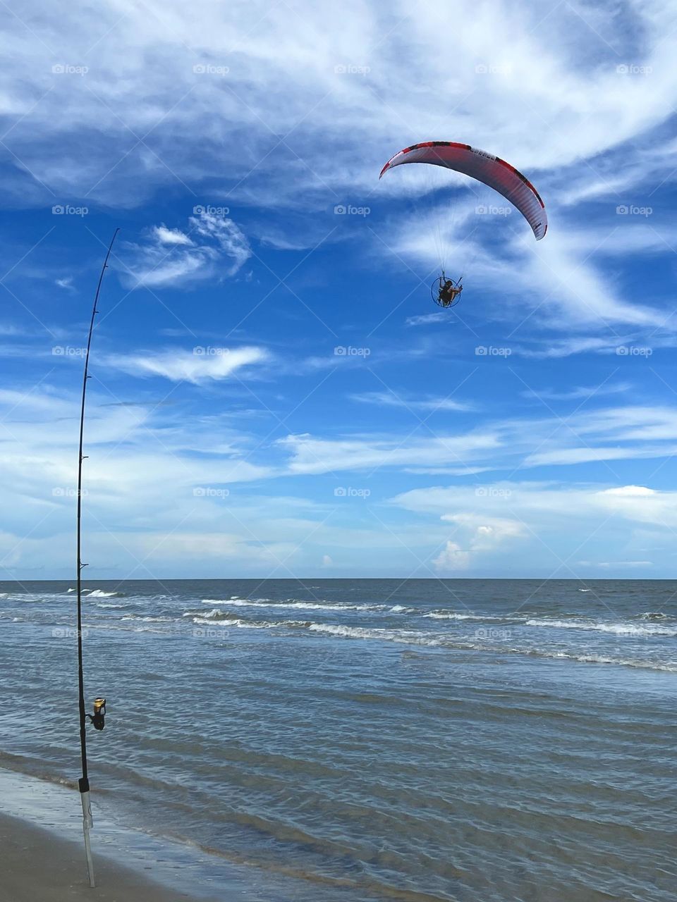 Editor’s choice. Paraglider over the surf at San Luis Pass, while surf fishing for fish, not people lol!