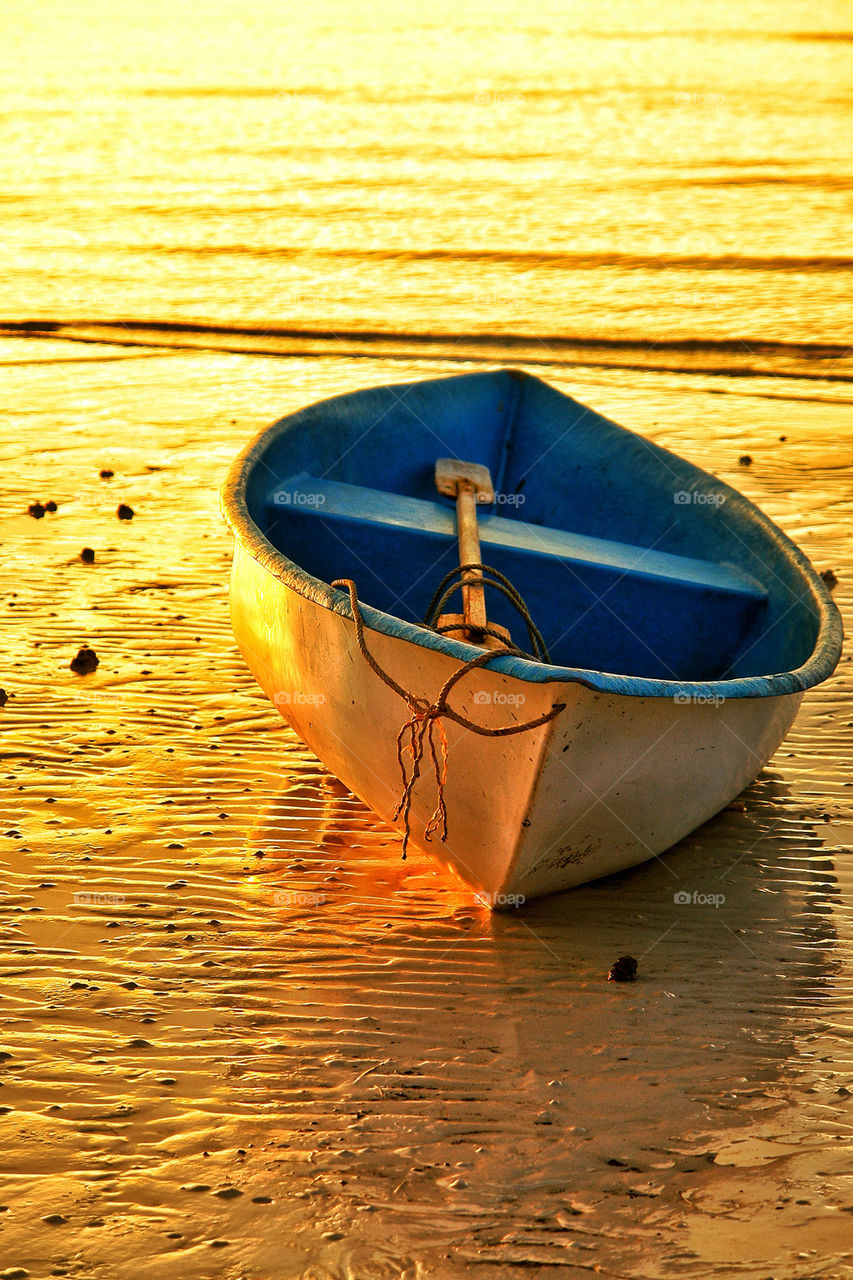 Empty wooden boat at beach