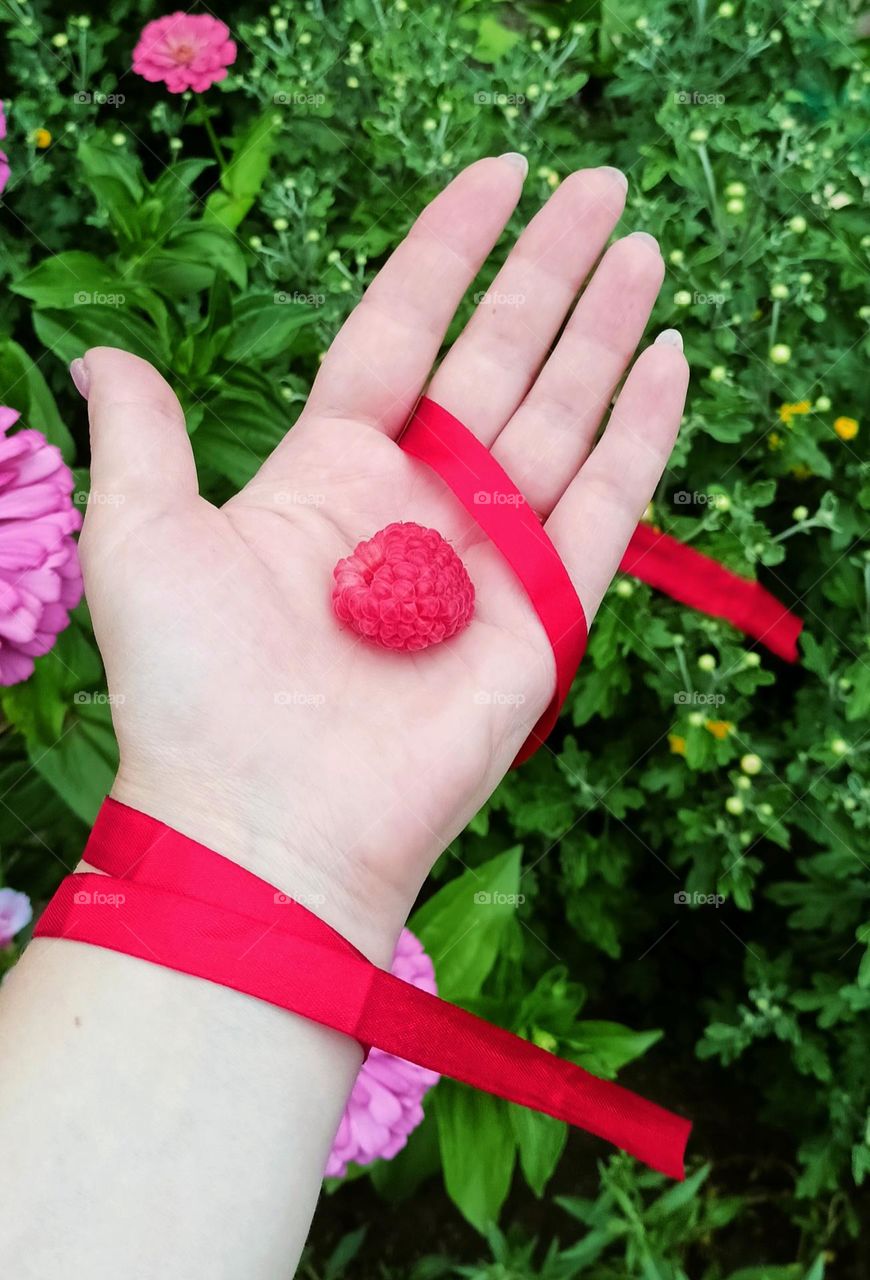 Berry in the palm of a woman's hand