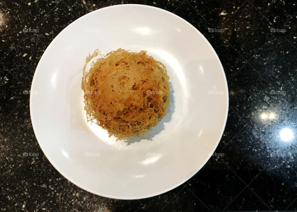 Taro marinated fried like dim sum. Could be starter or dessert with a bit sweet and salt taste.