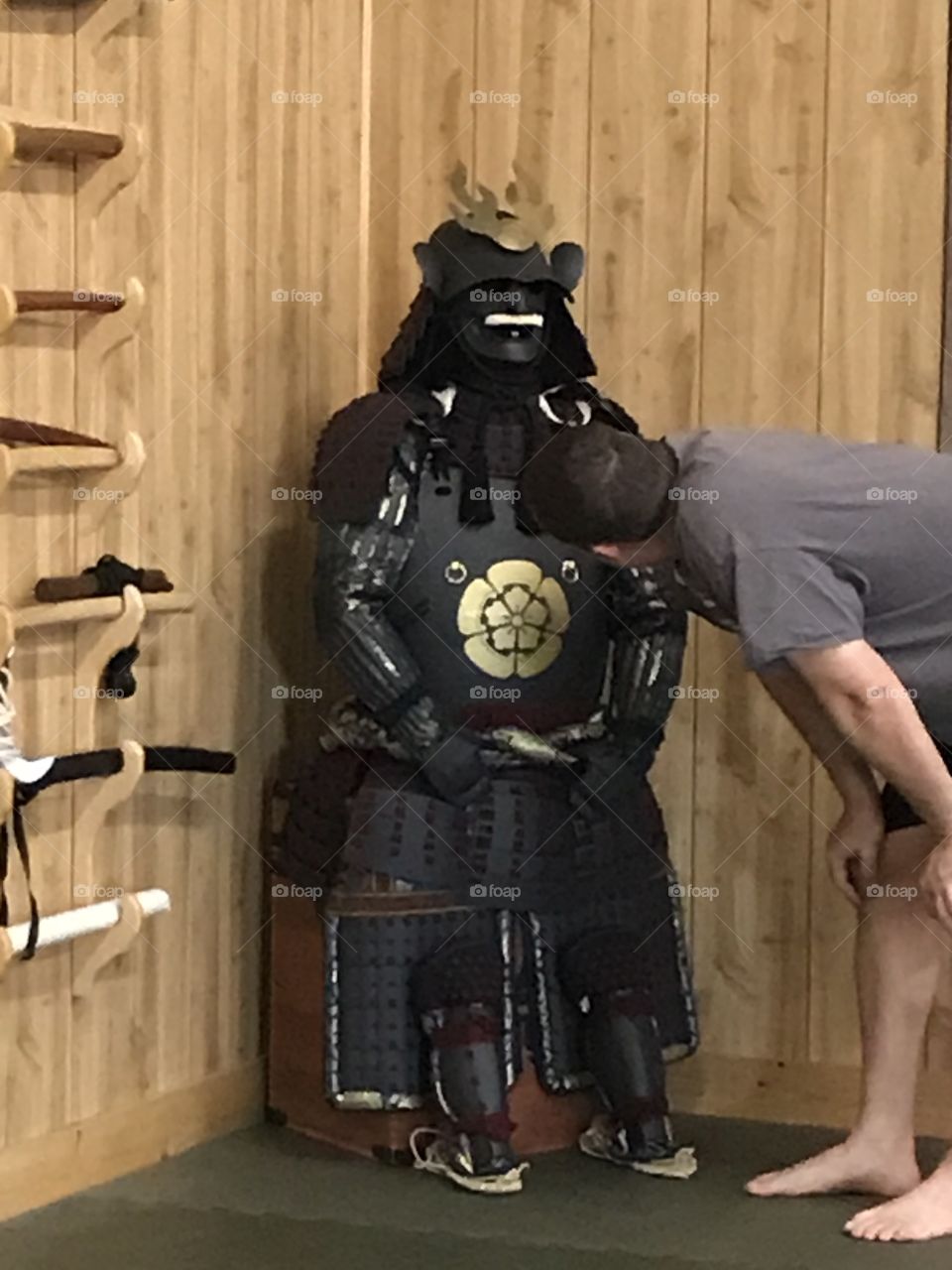 Checking every detail of the samurai armor up close and personal at the dojo. It is definitely curiosity at its best.