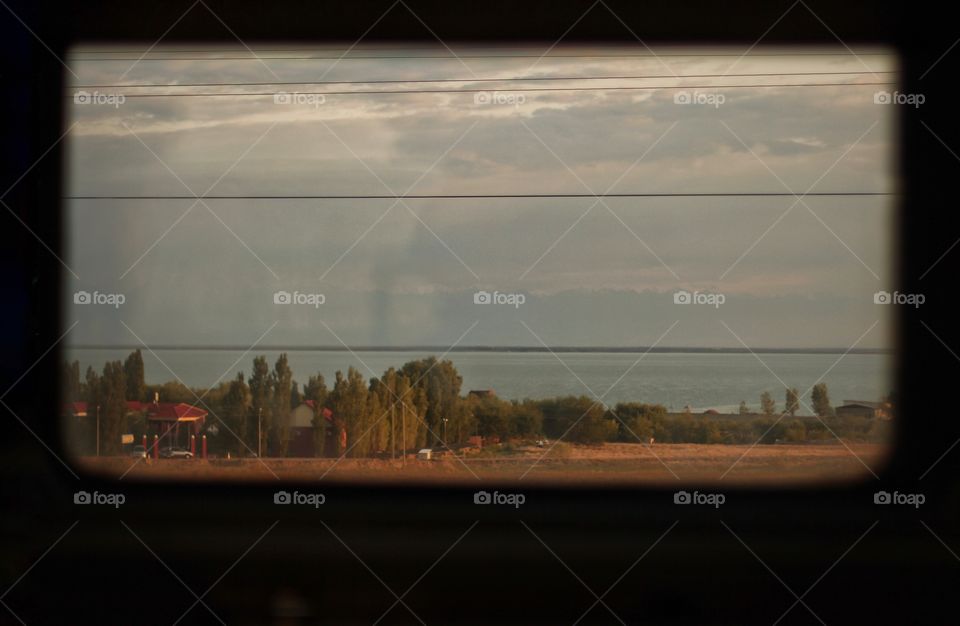 Window on the train overlooking the lake