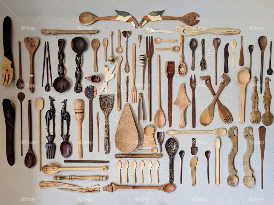 a collection of wooden utensils from around the world