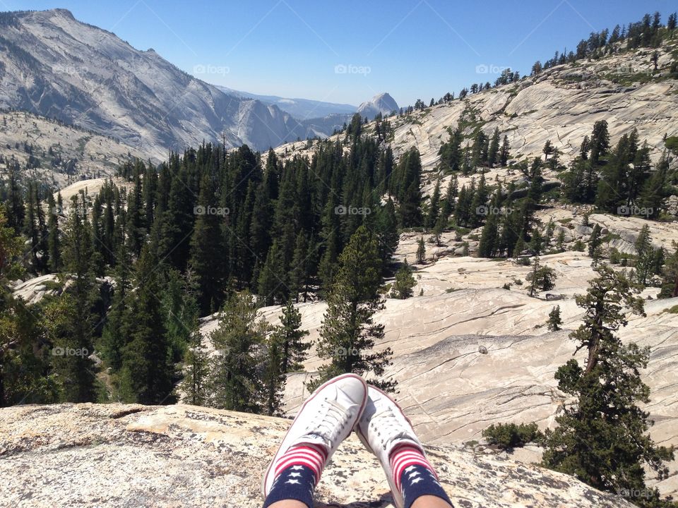 Feet above in the cliff at the Yosemite National park 